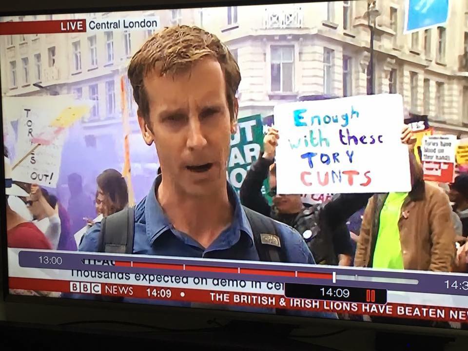 The BBC just broadcast a sign calling the Tories 'c*nts'